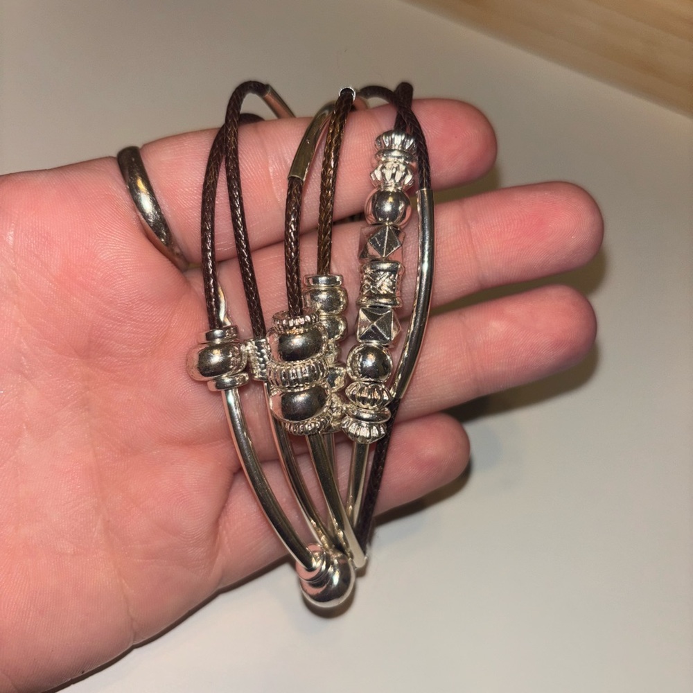 Silver and Brown Multi-Strand Bracelet with Intricate Detailing